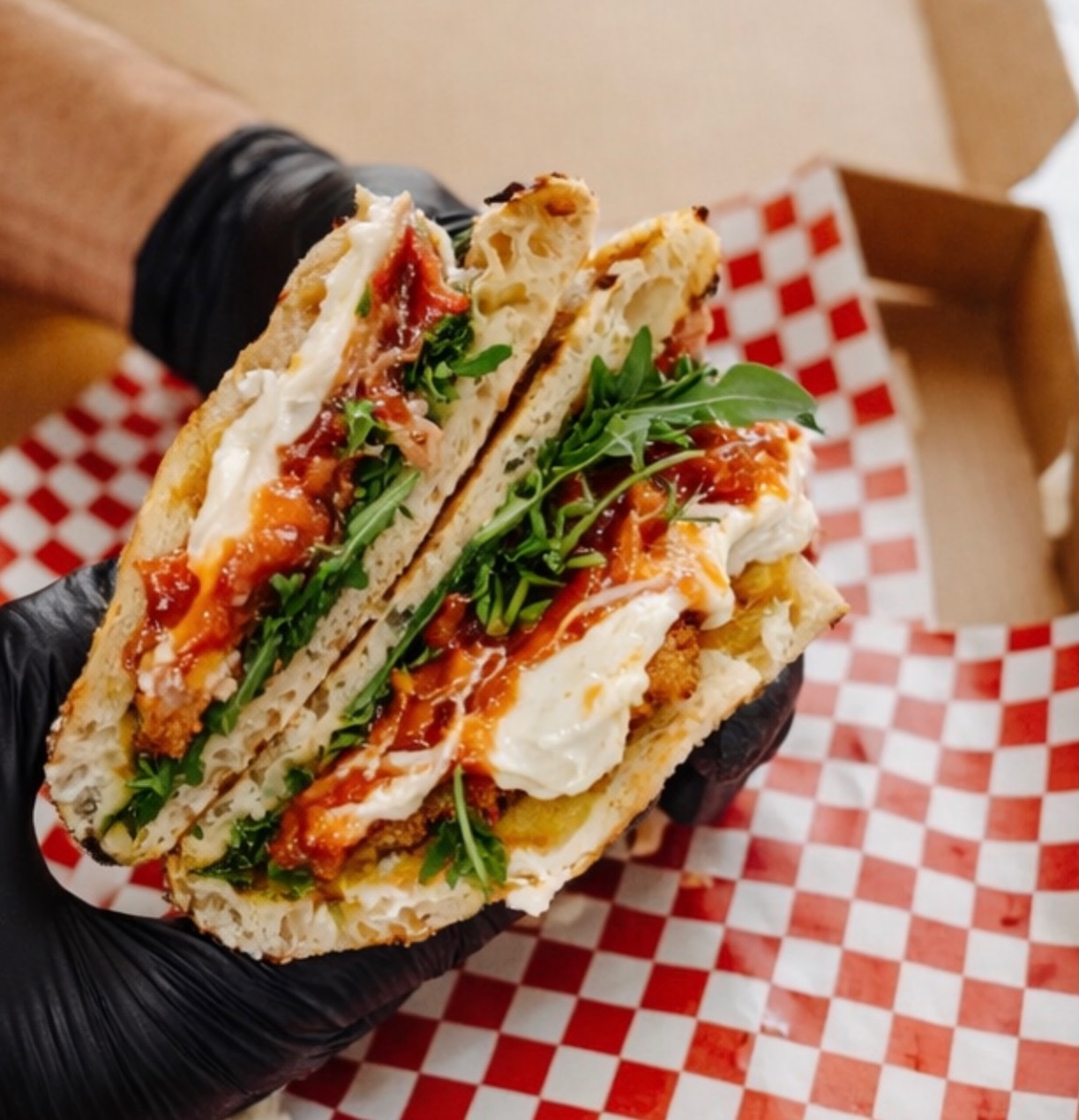 Fresh panino with rocket and creamy cheese